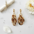 Goddess 1 Gold Leverback Flat Lay