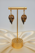 Gold T-bar earring display with elegant base