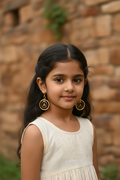 Little Indian girl wearing gold leverback earrings