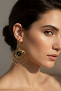 Spanish Model Wearing Gold Leverback Earrings